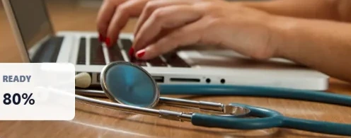 Healthcare administration with a laptop and stethoscope