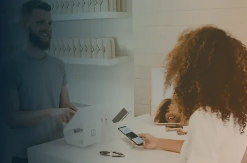 Customer making a purchase at a retail counter